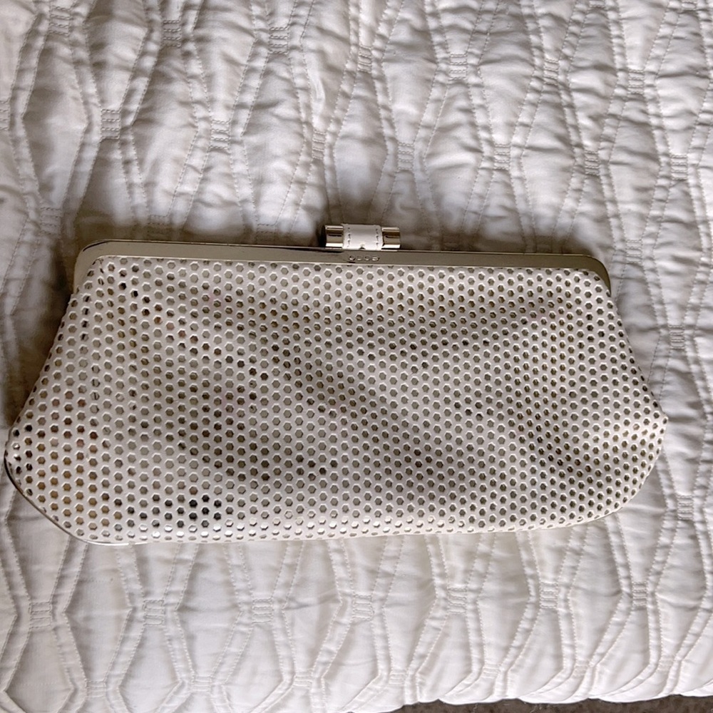 Bebe clutch. White and gold